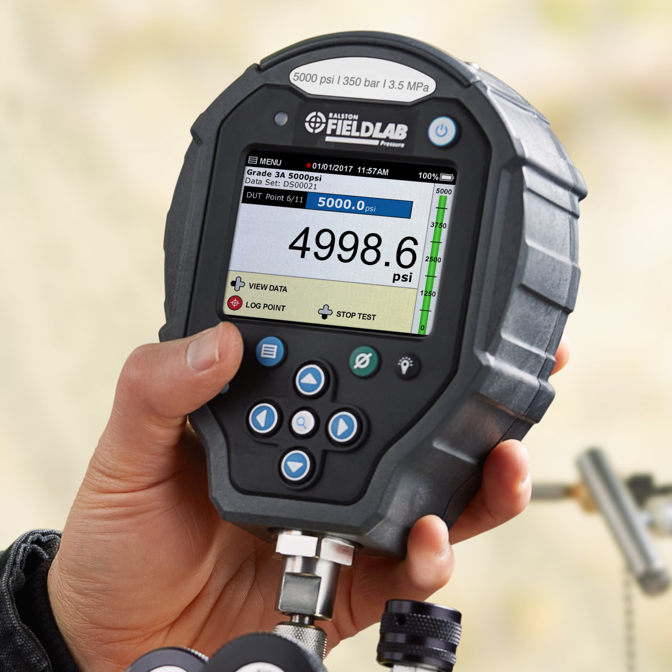 Technician using a digital pressure calibrator from Ralston Instruments