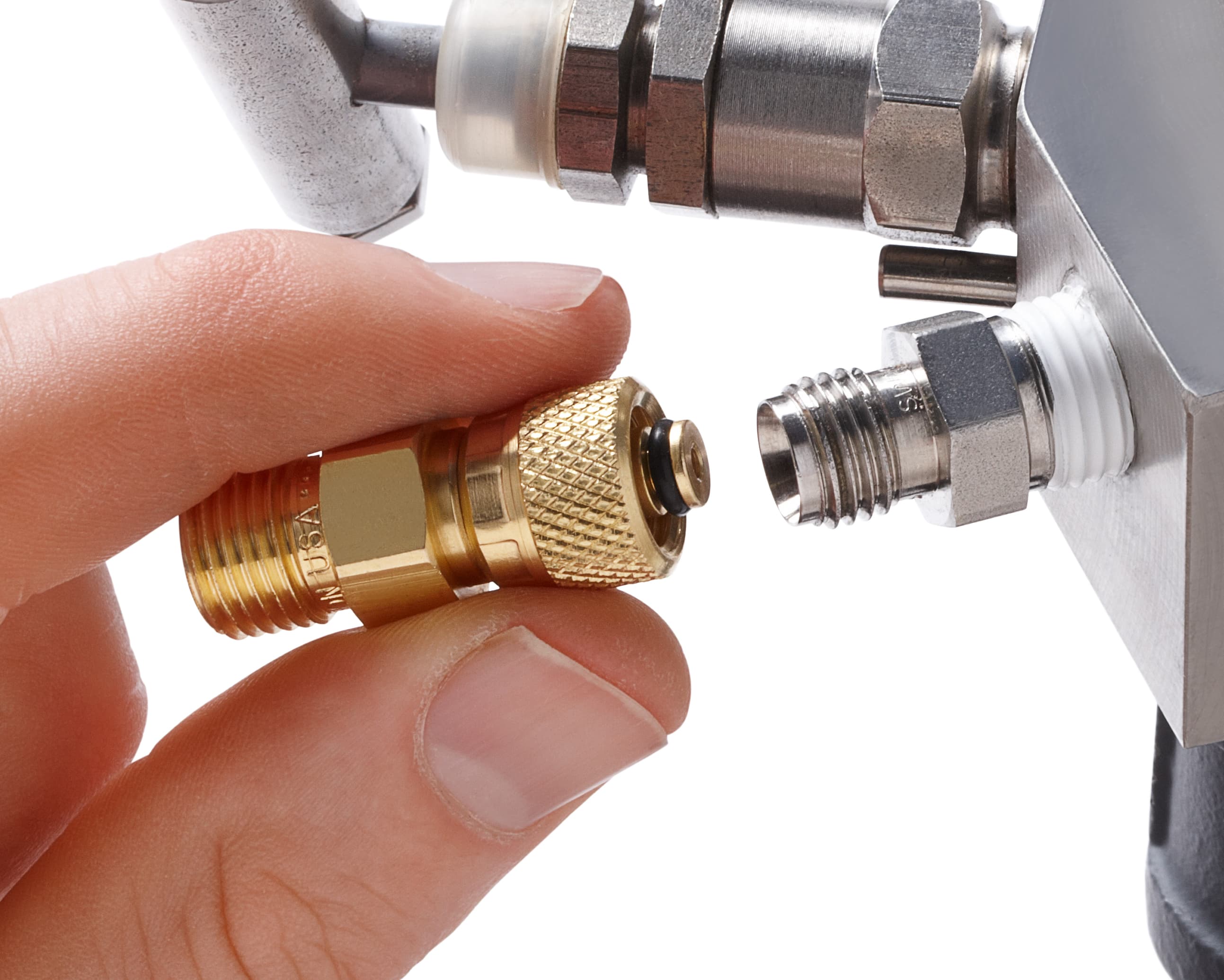 Technician connecting a Ralston Quick-test™ tube fitting for fast, leak-free calibration setup without thread sealant.